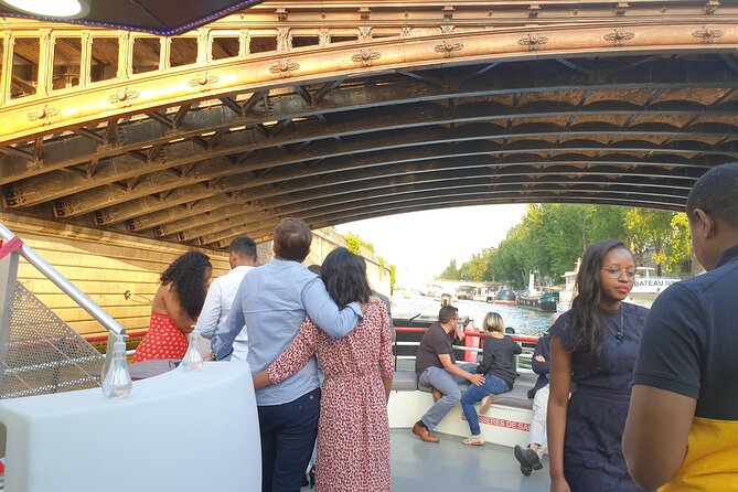 Dinner Cruise Prestige Check-out from the Eiffel Tower - The dining setup: glass roof views plus a set French menu