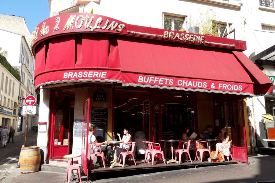 German private Walking Tour through Montmartre & Passages - Grands Boulevards: switching from hill lanes to wide-city views