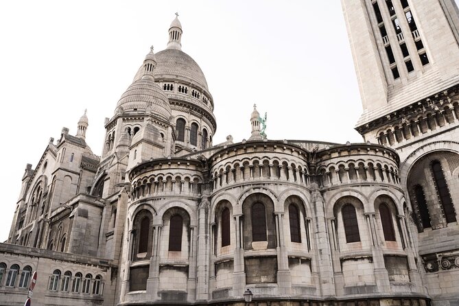 Hidden Montmartre: Paris' Secret Streets Walking Tour - Stop 4: Le Moulin de la Galette and the secret passage viewpoint