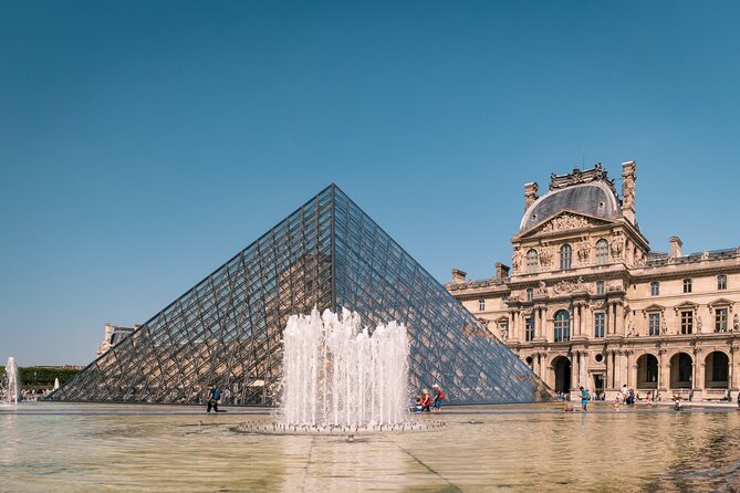 Louvre Museum Masterpieces Guided Tour with Access - Meeting at the Arc de Triomphe du Carrousel, then stepping into the Louvre mindset