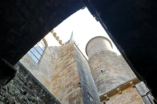 Mont Saint-Michel Day Trip from Bayeux (Shared tour) - On the ramparts and toward the abbey: walking with purpose