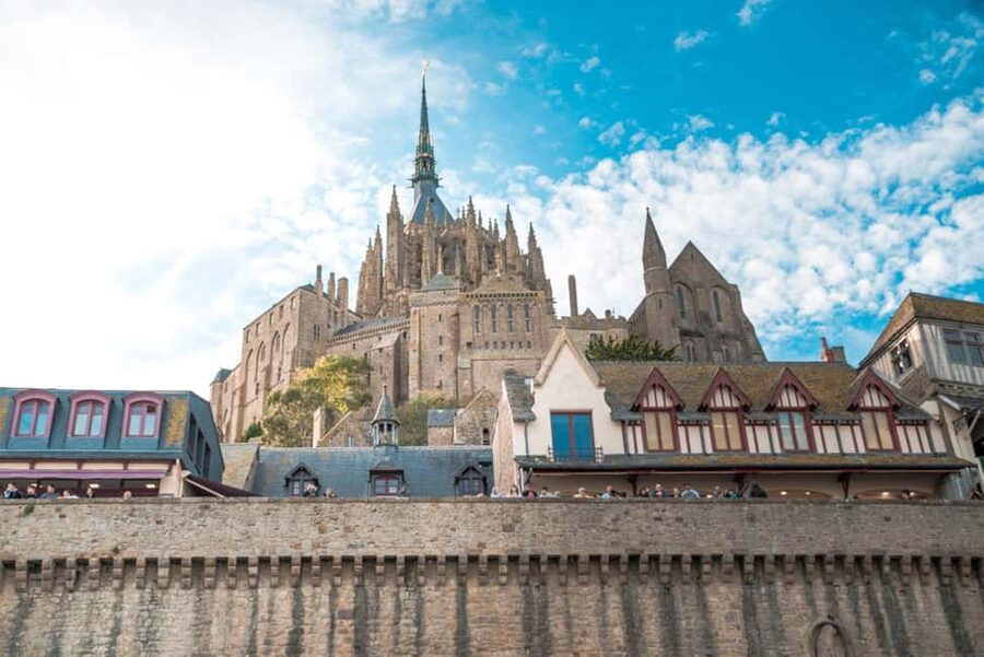 Mont Saint-Michel Small-Group Day Trip from Paris with Abbey Ticket - Crossing the causeway and entering the fortified village