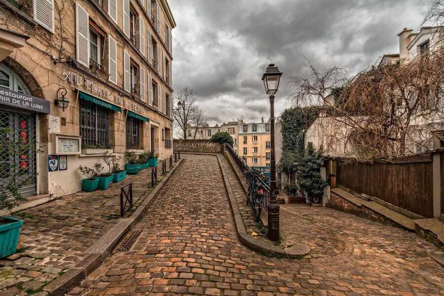 Montmartre Walking Tour in English - First Steps at Metro Blanche and the Yellow Umbrella