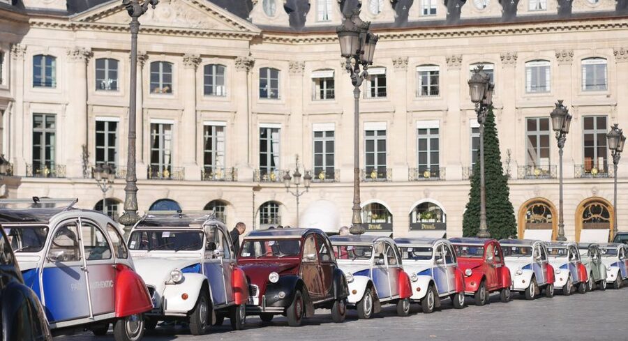 Paris: Classic Sites Tour by Vintage Citroen 2CV - Louvre glass pyramid to Île de la Cité: Notre-Dame in real street light
