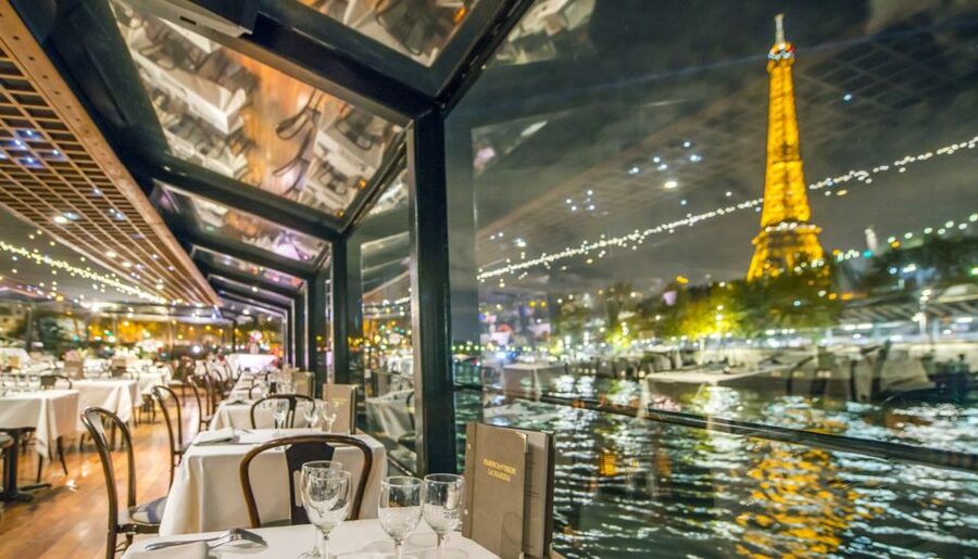 Paris: Dinner Cruise on the Seine and Eiffel Tower 2nd floor - Dinner on the Seine: private table comfort with a real-world menu caveat