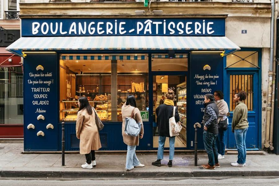 Paris: Gourmet Food Tour with Over 10 Tastings and Wine - Meeting at Place Colette and getting the tour rolling fast