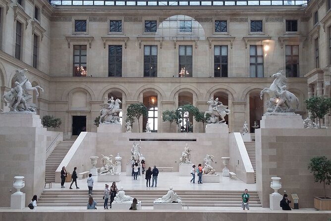 Paris: Louvre Museum Tour Mona Lisa & Iconic Masterpieces - Entering through the Pyramid with reserved access