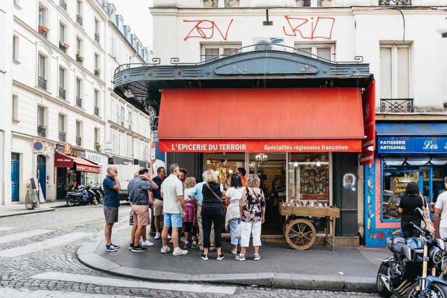 Paris: Montmartre Food and Wine Guided Tour - Sacré-Cœur summit views that make the climb worth it