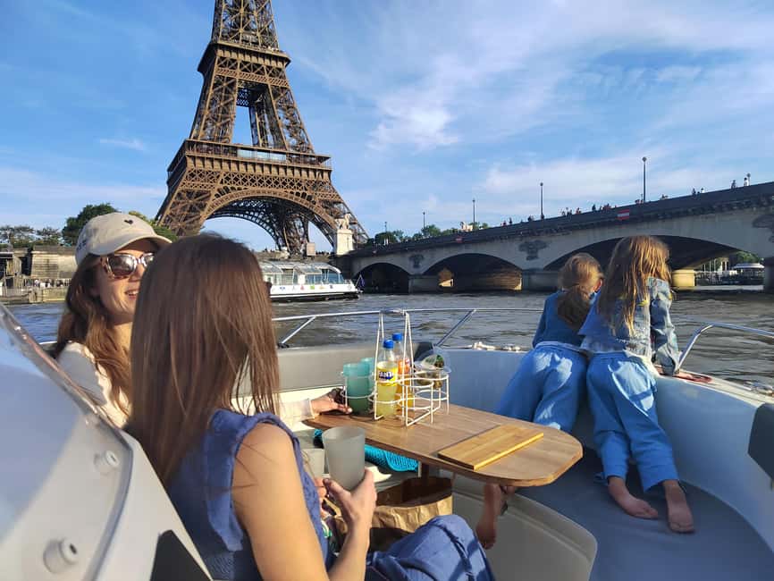 Paris Private Boat Seine River with Captain Guide - Boat setup: big table comfort, no roof, and smart seating