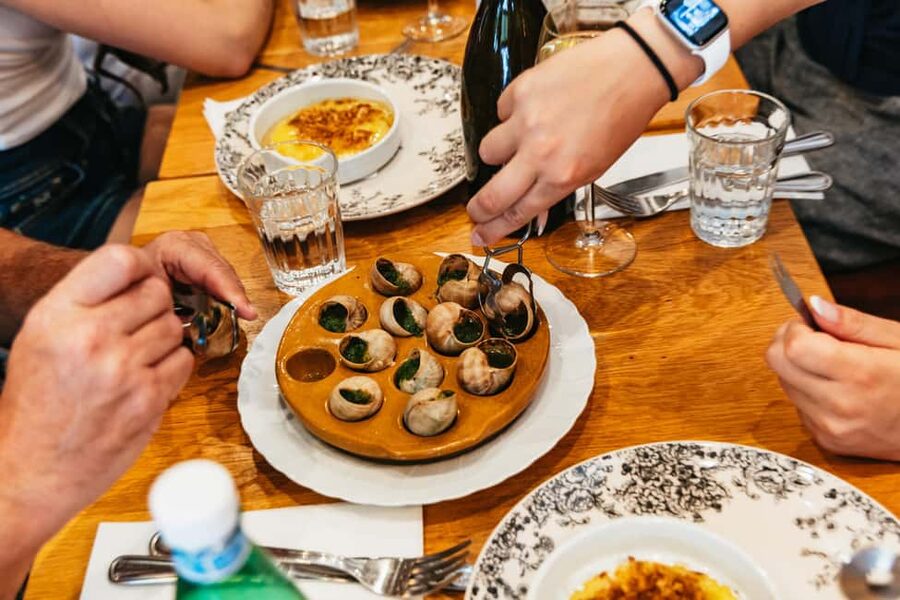 Paris: Walking Food Tour with Cheese, Wine and Delicacies - Charcuterie, Cured Hams, and the One Restaurant Stop