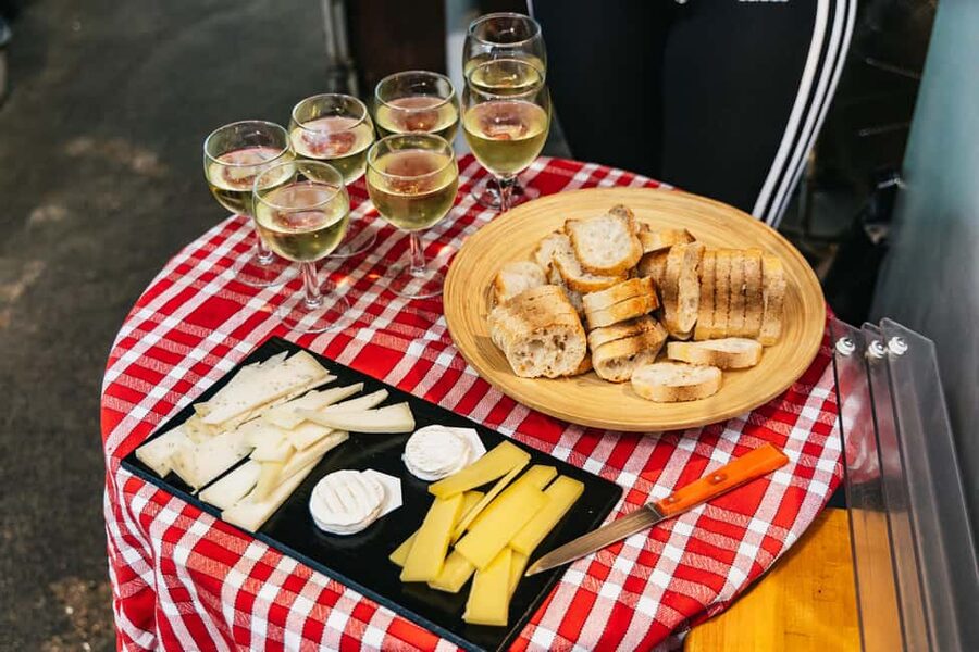 Paris: Walking Food Tour with Cheese, Wine and Delicacies - Where the Tour Starts: Le Repaire de Bacchus and Your First Bites