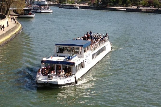 Seine River Cruise and Paris Canals Tour - Entering Canal Saint-Martin: locks, footbridges, and the Bastille tunnel