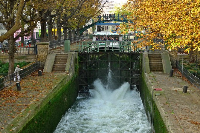 Seine River Cruise and Paris Canals Tour - Villette side scenery: Rotonde de la Villette, Paris Plages, and the liftbridge